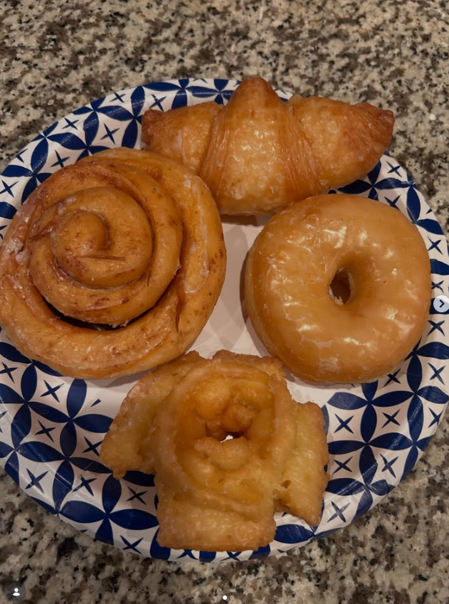 Guests enjoying donuts and coffee