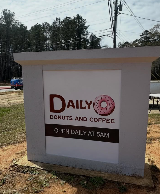 DailyO Donuts and Coffee storefront sign — open daily at 5AM